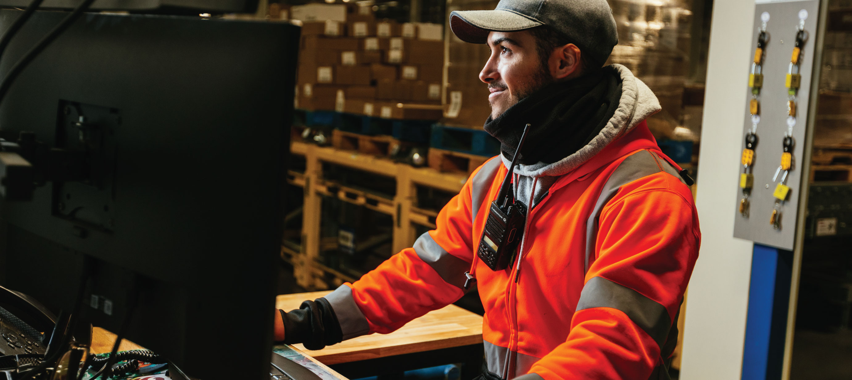 Lineage team member in cold storage warehouse, using the Lineage Link platform for real-time supply chain visibility.