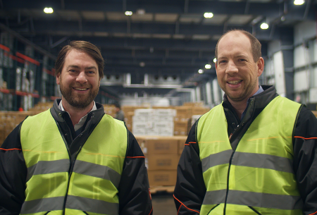 Lineage's co-founders stand in a cold storage warehouse smiling