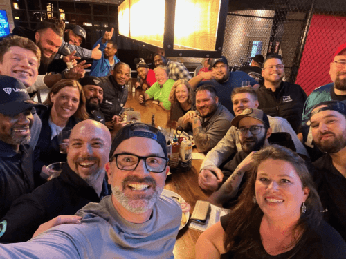 Lineage EDGE Program participants enjoying a social gathering at a lively restaurant, fostering camaraderie and connections outside of the workplace.