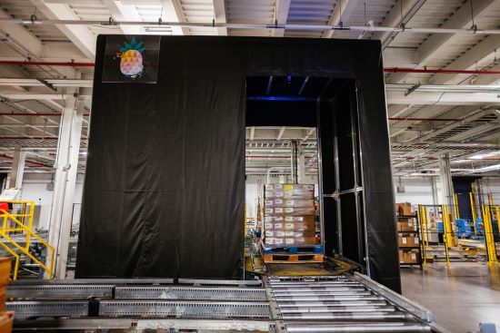 Pallets of goods moving through the Lineage Eye system in a cold storage warehouse, using AI-powered computer vision to enhance receiving accuracy.