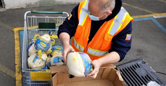 feeding america lineage team member unloading donated food