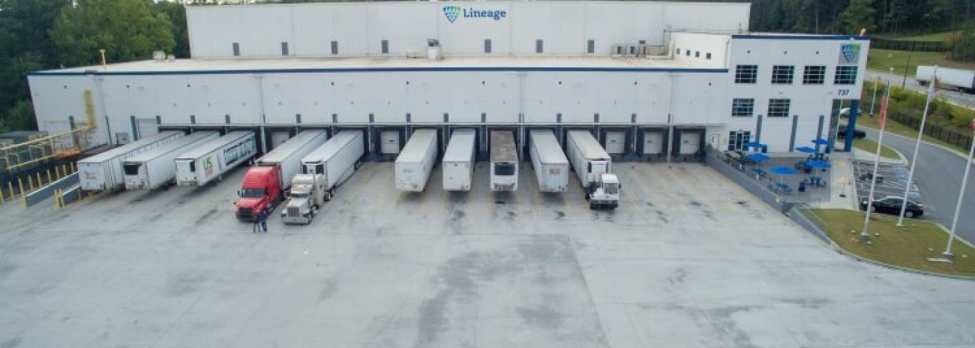 Front view of Lineage’s Lithia Springs cold storage facility in Atlanta, featuring multiple trucks docked at loading bays, emphasizing its logistics capabilities.