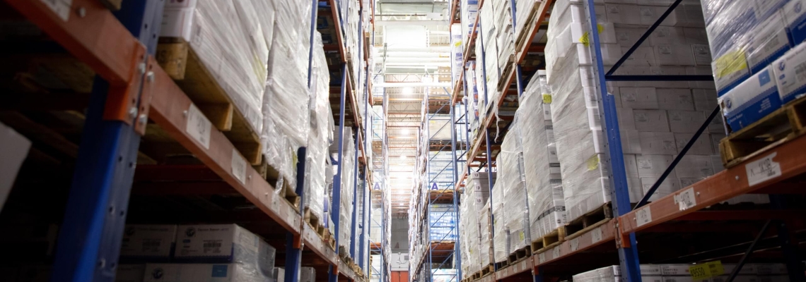 Rows of pallets in a bonded warehouse, showcasing organized storage solutions for imported goods under customs supervision.