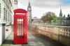 Iconic red phone box in front of Big Ben in London