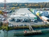 Waterfront view of Lineage’s Seattle-Michigan cold storage facility, highlighting port access and adjacent container storage.